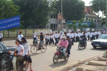 Marching on one of Phnom Penh's busiest streets